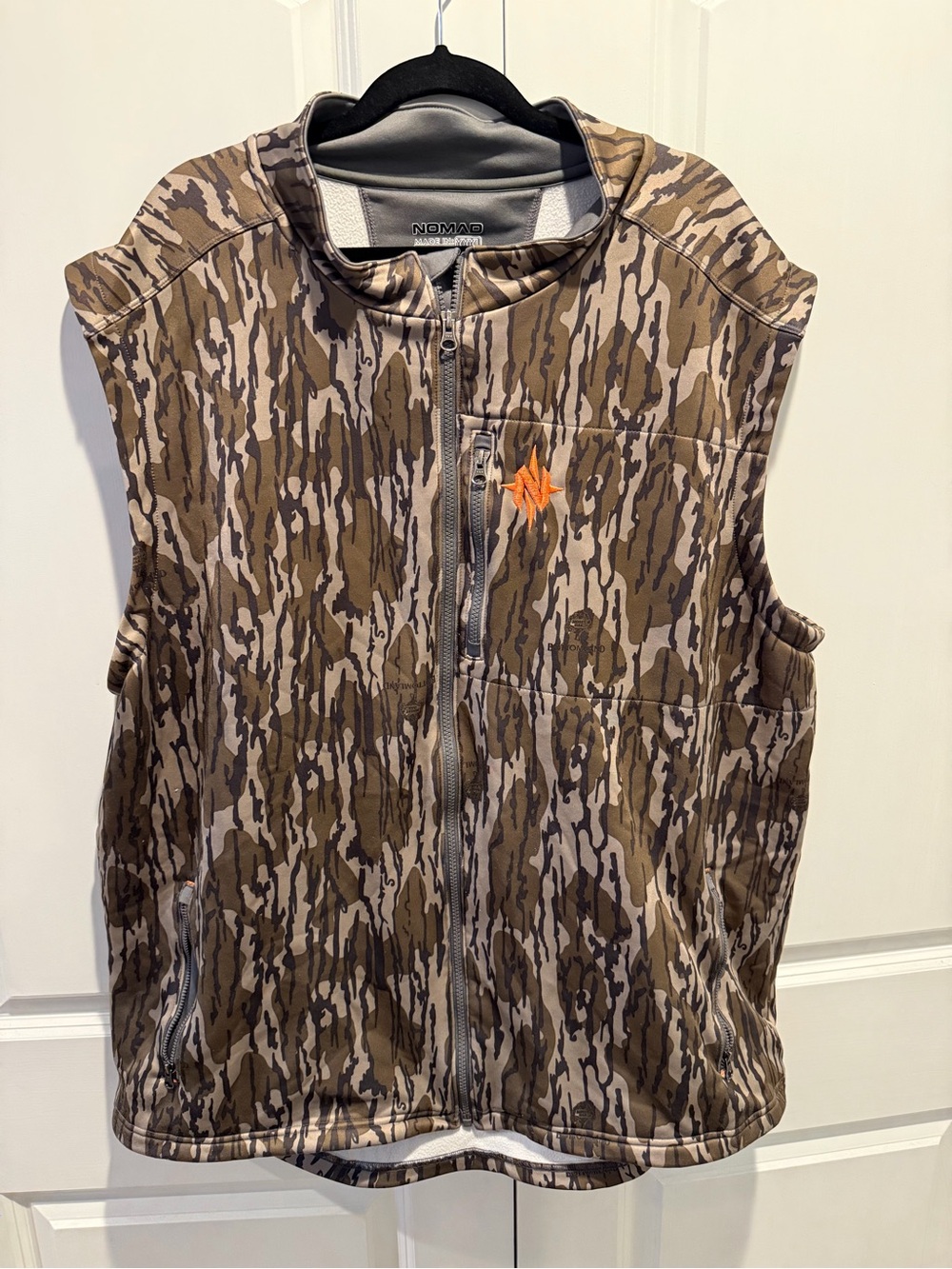Nomad Bottomland Camouflage Hunting Vest with Orange Logo
